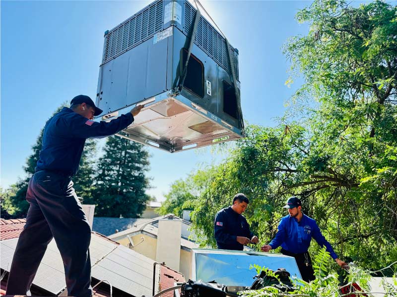 Skilled HVAC specialists installing a ac unit in fresno ca after being contacted for a hvac referral program