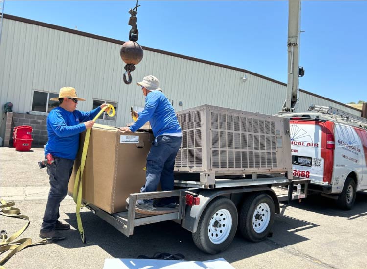 team of mechanical air in fresno, ca showcasing their professional ac installation process.