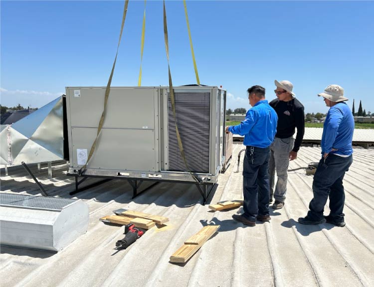 Mechanical Air's skilled crew demonstrating their expertise while replacing an old, inefficient air conditioner with a modern, energy-saving model.