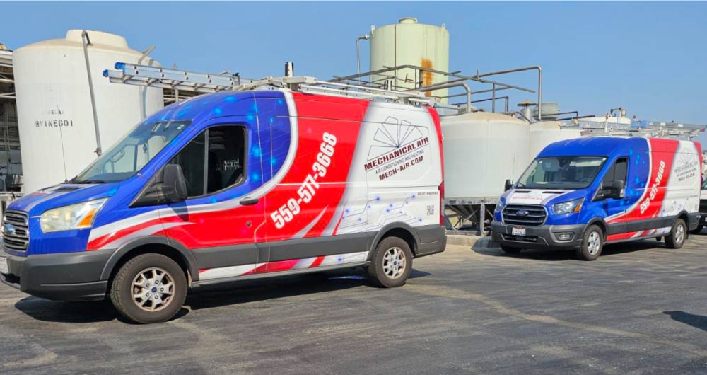 two mechanical air vans in a factory to perform commercial ac repair an ac cleaning 